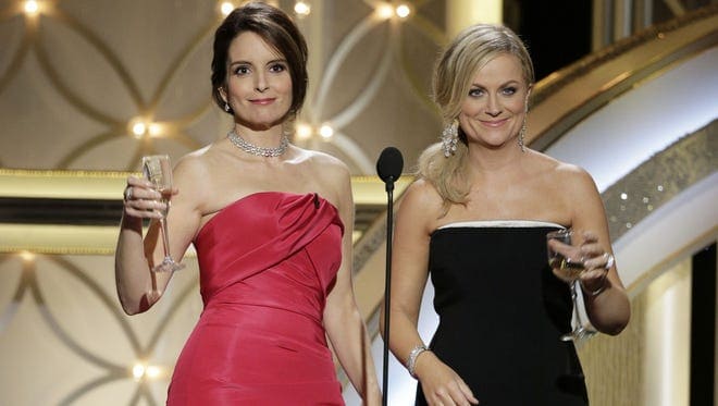Tina Fey and Amy Poehler, hosts of the 71st Annual Golden Globe Awards Show © Paul Drinkwater, AP