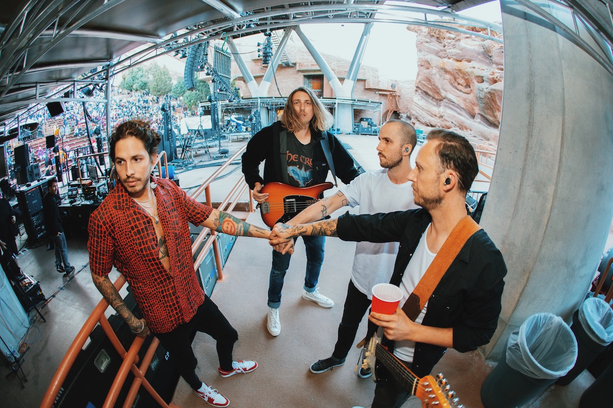 Katastro put their hands together pre-show at Red Rocks Amphitheatre, 2022 © Chris Fiq