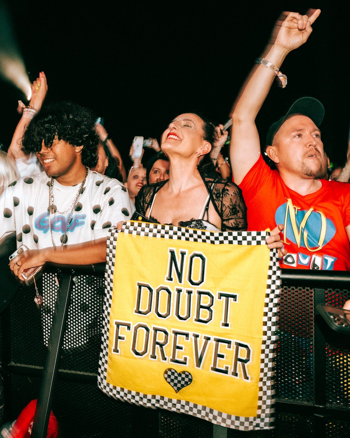 a fan holds up the message "No Doubt Forever" during the band's Coachella performance