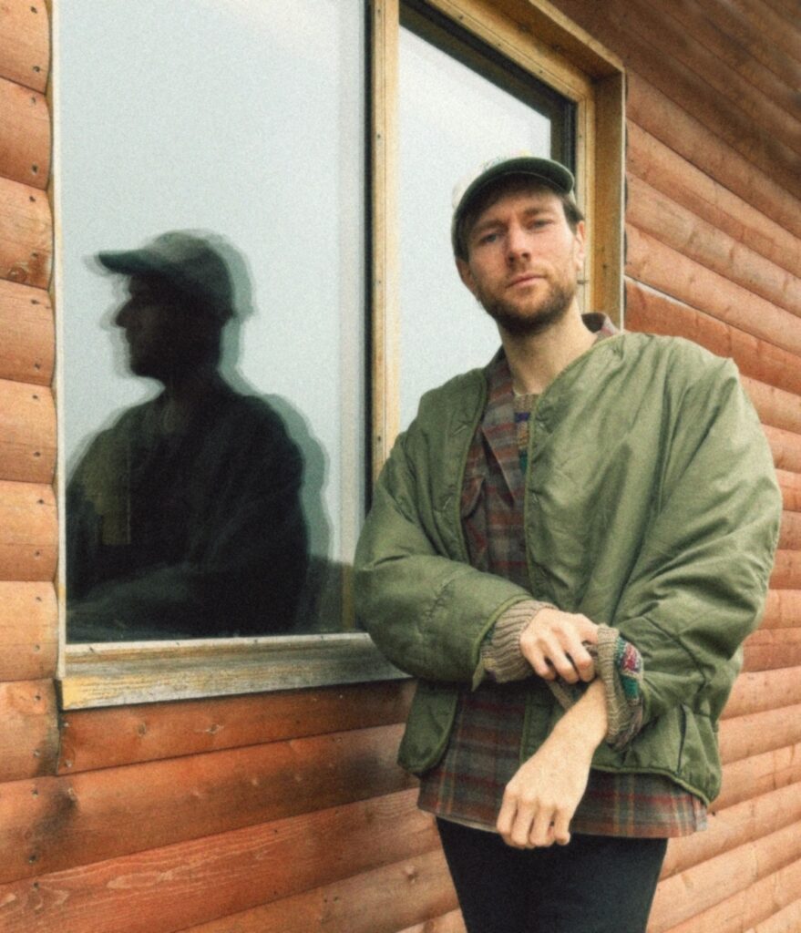 Novo Amor next to his studio window © 2024
