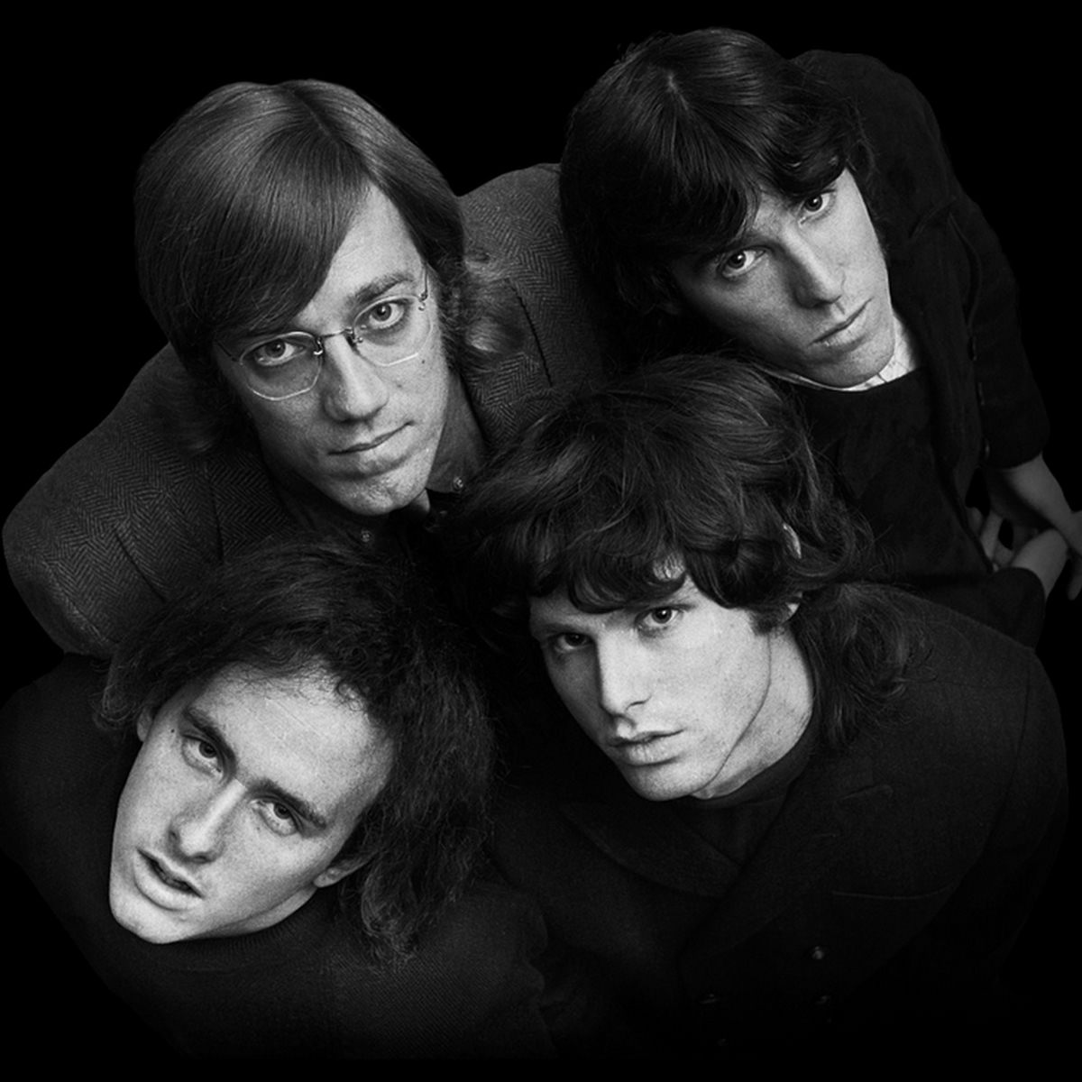 The Doors: vocalist Jim Morrison, keyboardist Ray Manzarek, guitarist Robby Krieger, and drummer John Densmore